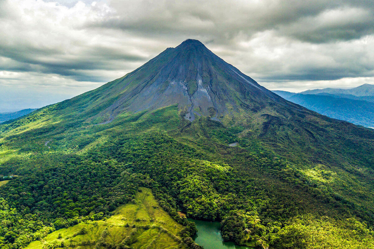 Arenal Volcano surrounded by lush rainforest in Costa Rica