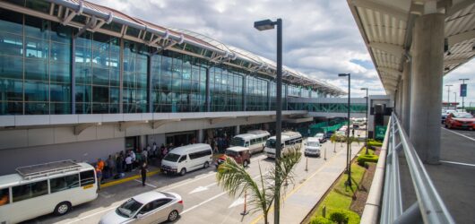 Airport terminal with shuttle vehicles for private transfers in Costa Rica