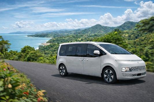 White private shuttle van traveling along the Pacific coast of Costa Rica